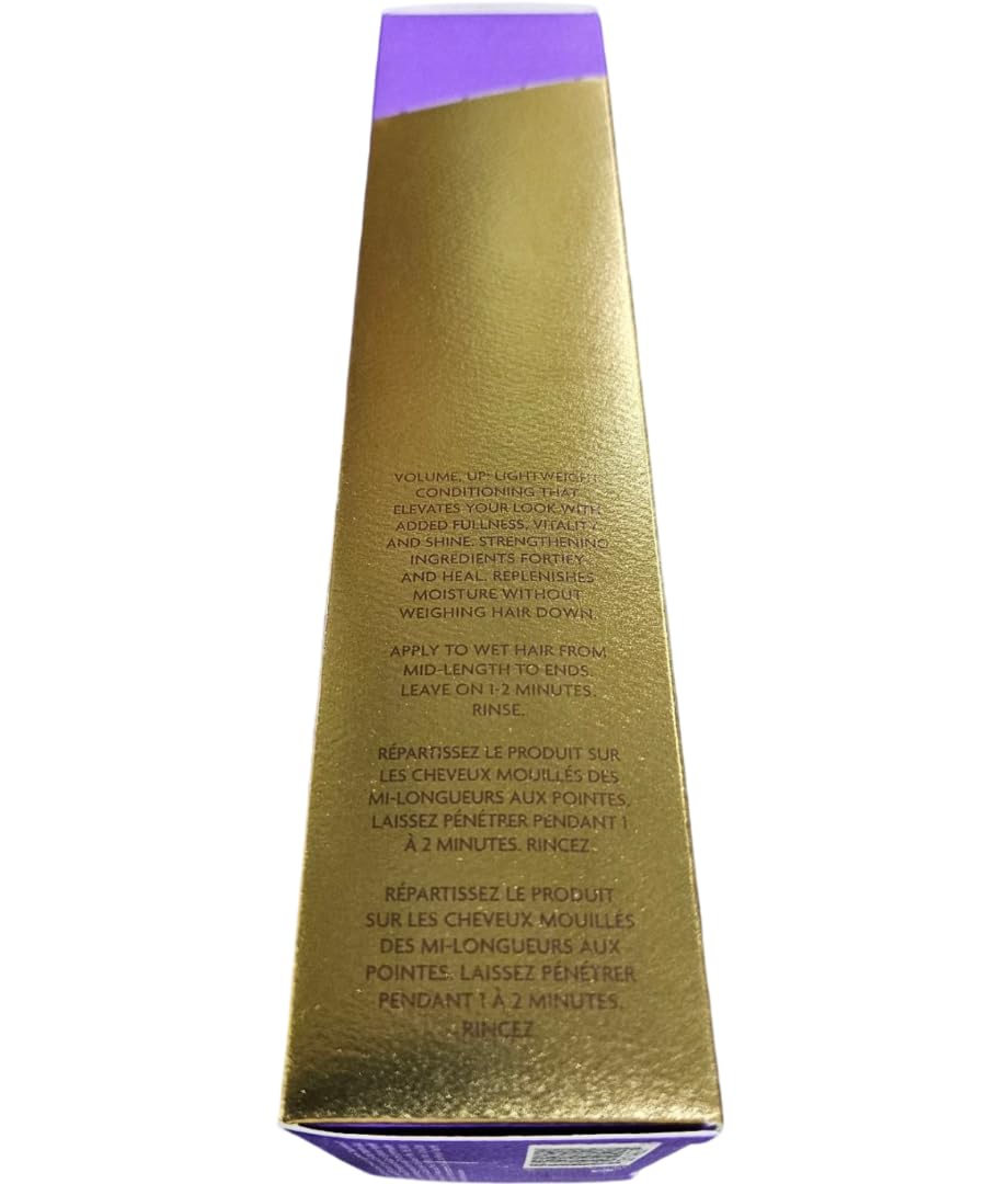 R+Co BLEU thickening conditioner in hand illustrating smooth consistency