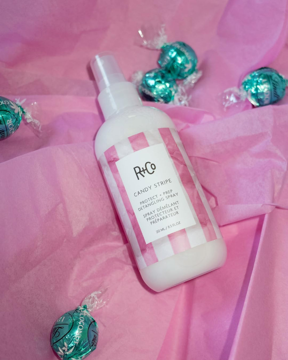 R+Co Candy Stripe Rosemary Leaf Extract close-up promoting scalp support for texture.