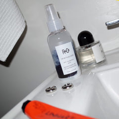 R+Co Spiritualized Dry Shampoo Mist pump-dispense close-up shows easy, residue-free application.