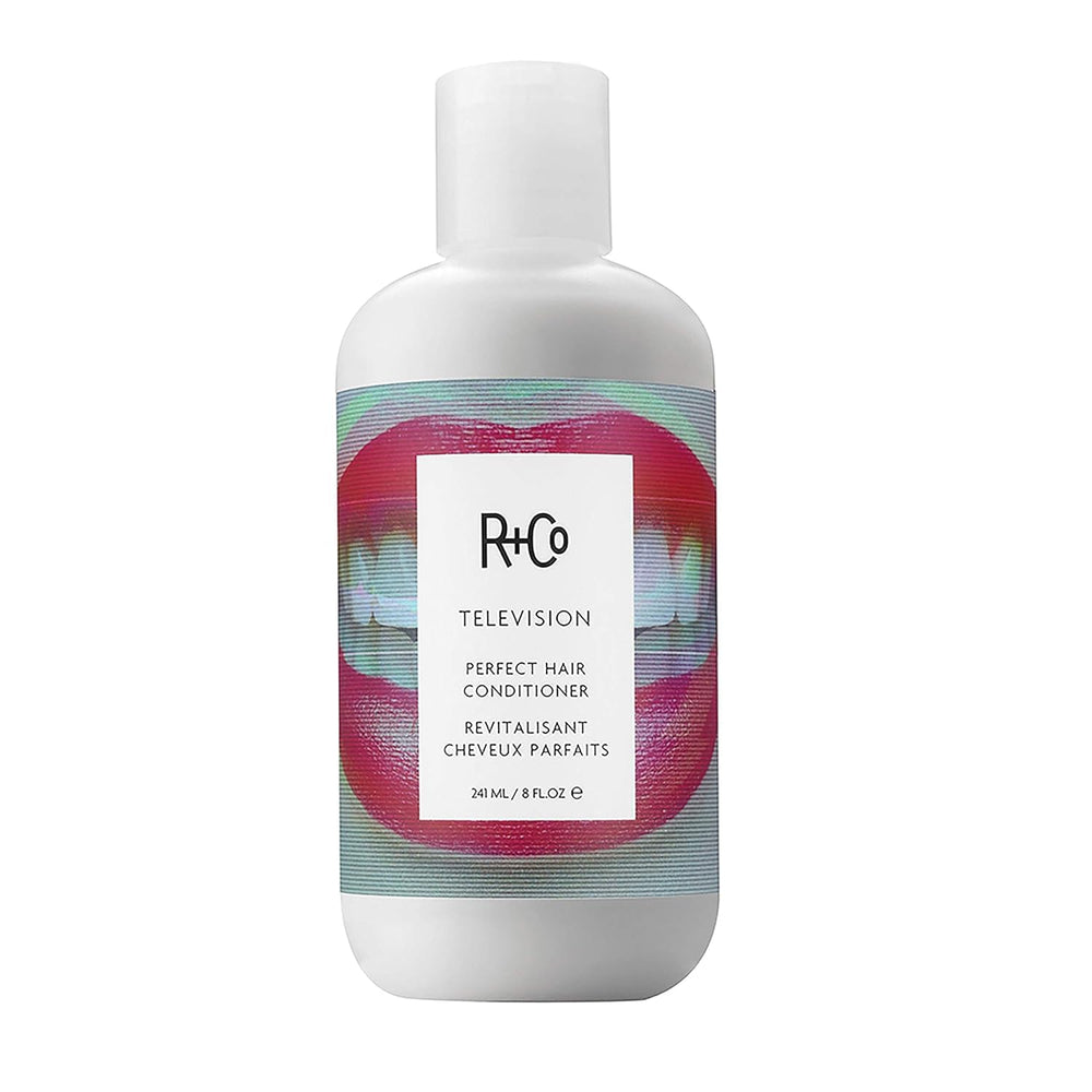 R+Co Television Perfect Hair Conditioner bottle close-up showing smooth, hydrated hair