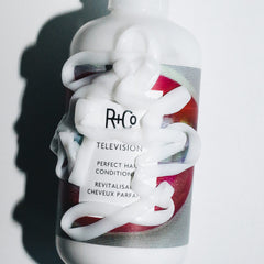 R+Co Television Perfect Hair Conditioner in a protective, eco-friendly styling scene