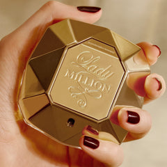 Rabanne Lady Million bottle on warm surface ideal for daytime glamour and scent presence.