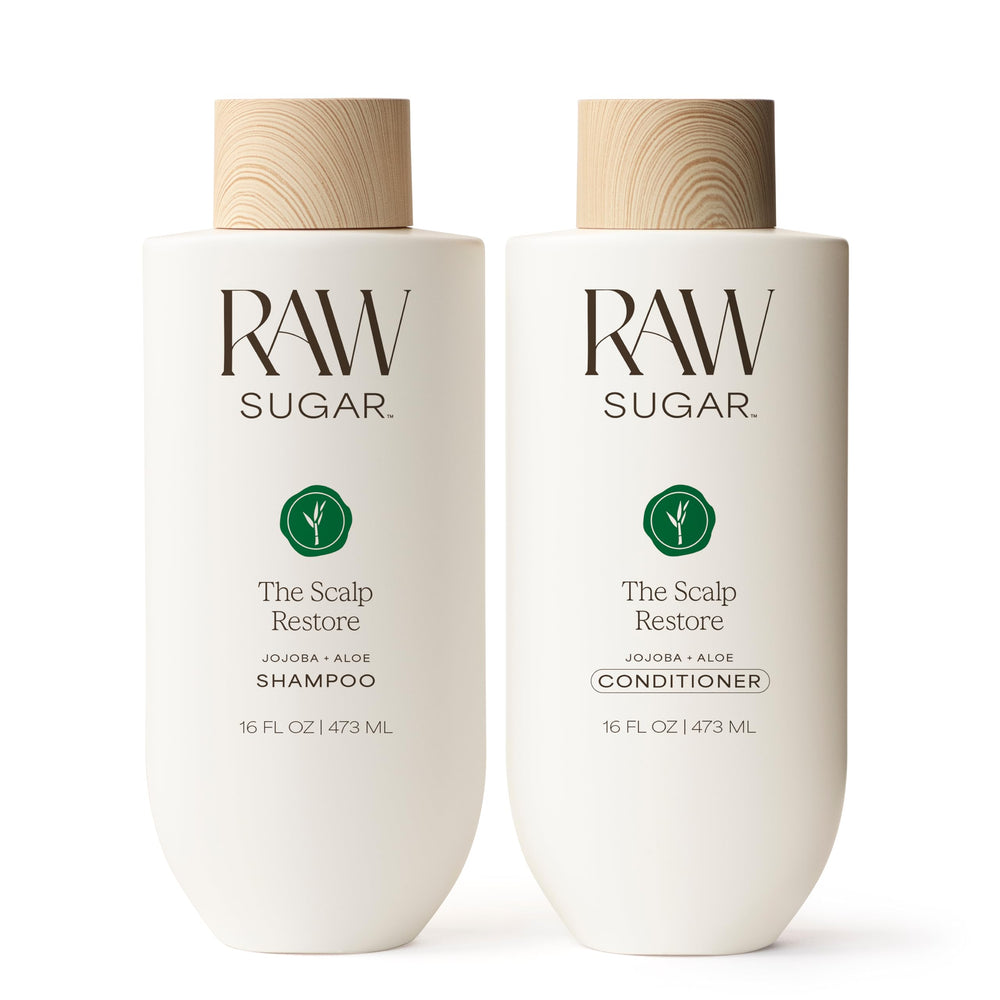 Raw Sugar Scalp Restore Shampoo bottle promotes a refreshed scalp and fuller-looking hair.