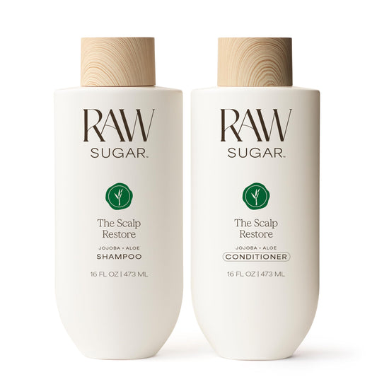 Raw Sugar Scalp Restore Shampoo bottle promotes a refreshed scalp and fuller-looking hair.