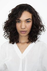 Styled curls on model demonstrate defined, frizz-free finish from the Cassette set.