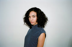 R+Co Cassette Curl Defining Masque applying to curls for revived softness