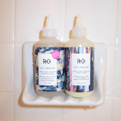 The R+Co Lost Treasure bottle with pump enables easy dispensing.