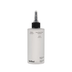 Refilled Cytokine Spa bottle close-up delivering deep hydration for stressed hair
