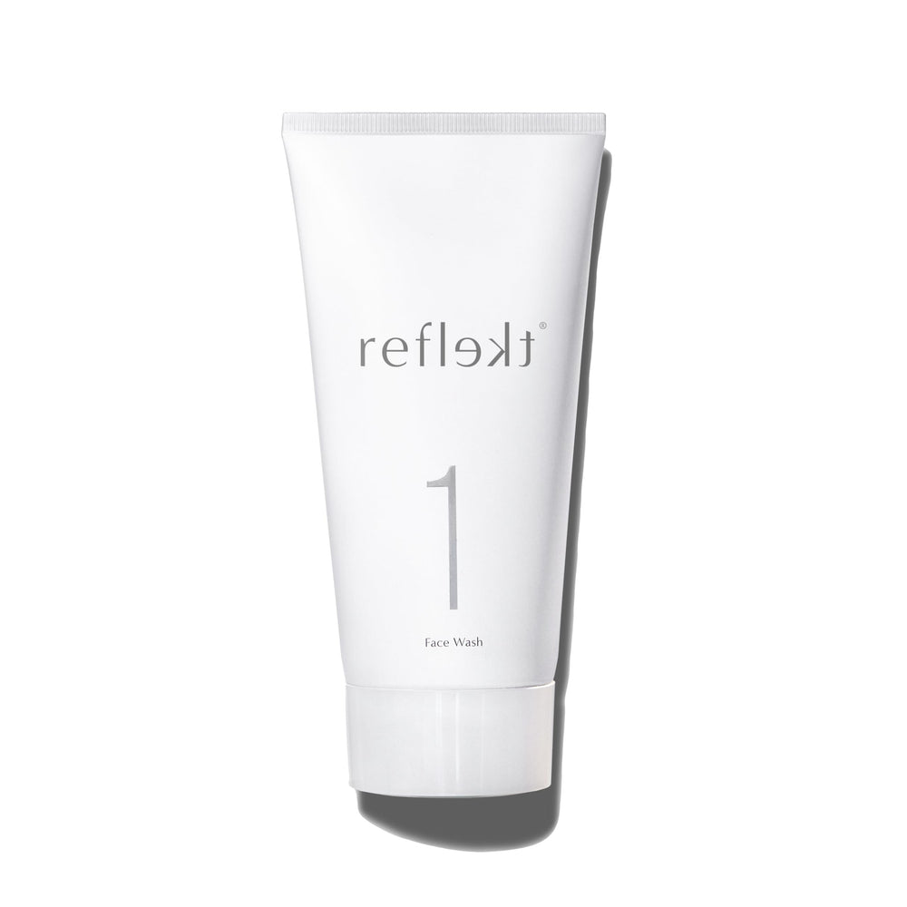 REFLEKT 1 daily exfoliating face wash bottle demonstrates gentle cleansing for clear pores.