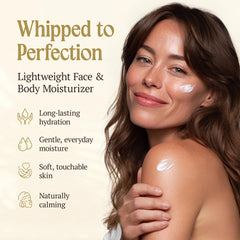 Hands applying Reminisce Angus Ranch balm for face and body hydration.