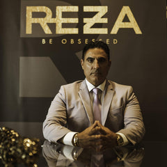 Packaging of Reza Fixation Shampoo with gold accents and premium branding.