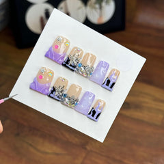 RIICFDD 10-piece handmade press-on nails kit with medium duck design for quick manicures.