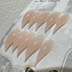 RIICFDD dragon-claw nails in glossy nude finish for bold at-home glam
