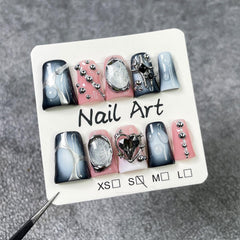 RIICFDD kit includes 10 nails, glue, cuticle stick, and travel pouch for on-the-go nails