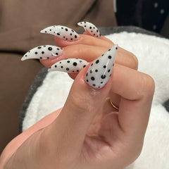 RIICFDD thick press-on nails in white stiletto with polka dots for at-home salon-grade manicure.