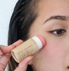 River Organics Peachy blush on lips for a subtle pop of color.