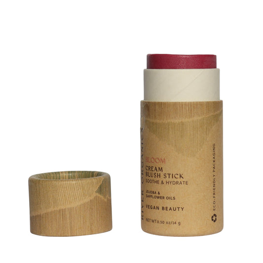 River Organics vegan blush stick packaging in recyclable paper tube for eco-friendly routines.