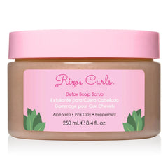 Rizos Curls Detox Scalp Scrub bottle pour shows smooth texture and cleansing benefits