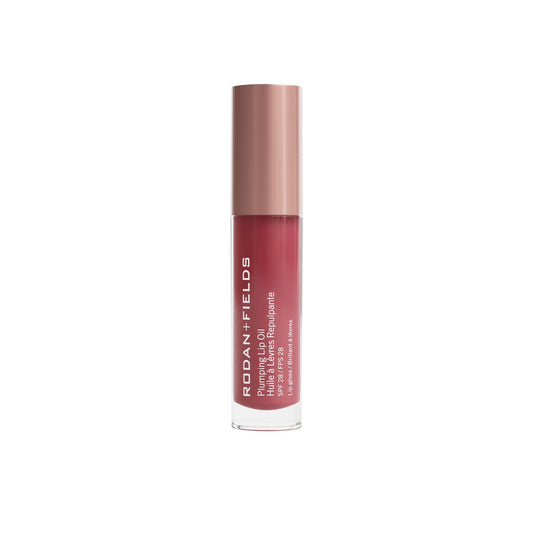 RODAN + FIELDS Plumping Lip Oil SPF 28 berry bottle delivers sheer tint and hydration.