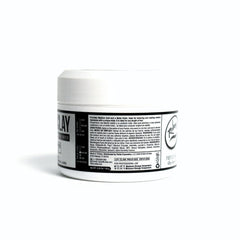 Lifestyle setup with Rolda Hair Clay on shelf nearby.