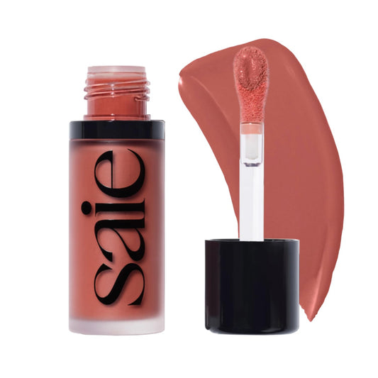 Saie Dew Liquid Blush close-up showing creamy, dewy color for a natural glow.