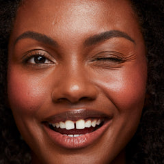 Saie Dew Liquid Blush swatch highlights a lightweight, hydrating formula.