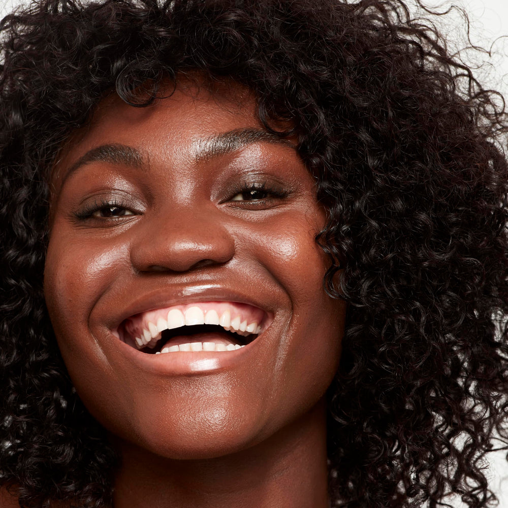Saie Glowy Super Skin Tint pump demonstrates easy, mess-free application.