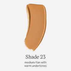 Saie Glowy Super Skin Tint being shaken to activate the serum blend.