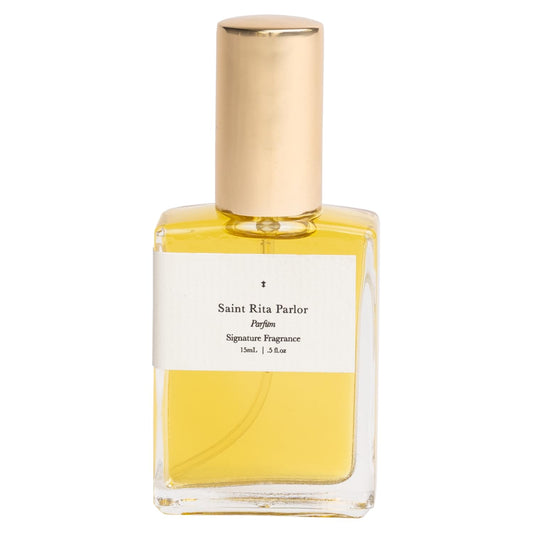Saint Rita Parlor Signature Parfum bottle closeup reveals luxury craftsmanship.