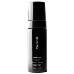 Saltyface tanning foam bottle in light-to-medium shade for an even, transfer-free glow.