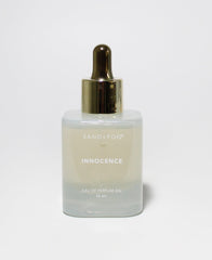Sand + Fog Innocence perfume oil bottle with dropper for precise, long-lasting scent on-the-go