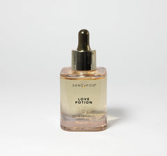 Sand + Fog Love Potion bottle close-up, highlighting premium glass and dropper for precise use