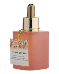 Sand + Fog Lychee Dream dropper-cap close-up shows controlled application and long-lasting scent.