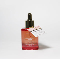 Sand + Fog Strawberry Shake dropper bottle delivering lasting gourmand strawberry cream fragrance