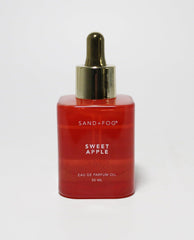 Sand and Fog Sweet Apple perfume oil bottle with dropper for precise application and long-lasting wear.