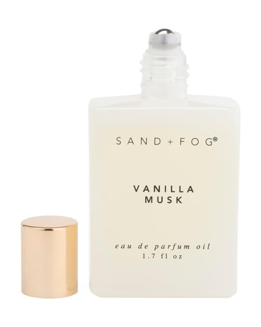 Sand + Fog Vanilla Musk rollerball application on skin for precise touch-ups