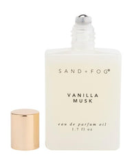 Sand + Fog Vanilla Musk rollerball application on skin for precise touch-ups