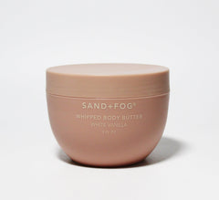 Sand + Fog Whipped Body Butter in a rose-gold jar for lasting hydration and subtle vanilla scent