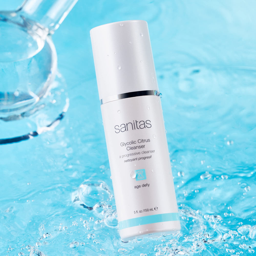 Close-up of the gel texture of Sanitas Glycolic Citrus Cleanser exfoliating to reveal a clearer complexion.