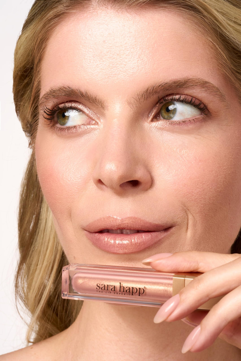Lips wearing Sara Happ Rose Gold Slip Luxe Gloss for long-lasting shine and hydration