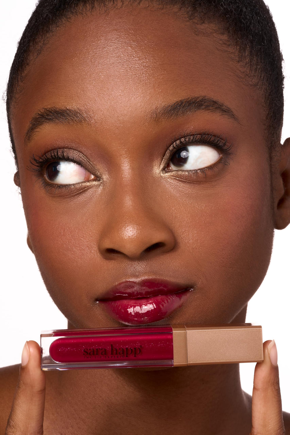 Sara Happ Wild Berry Slip Luxe Gloss on lips adds moisture and shine