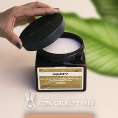 Rinsing out Saryna Key mask after 2–5 minutes for fresh feel.