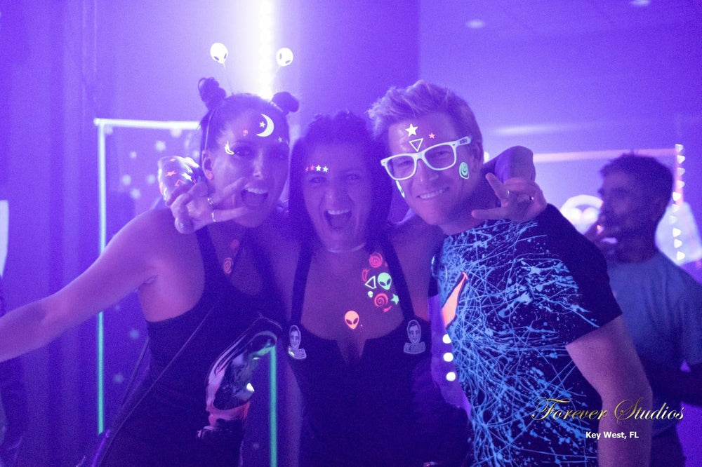 Sasswear neon orange star stickers add bold color at raves and glow parties.