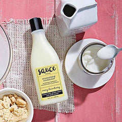 Sauce Beauty Creamy House Dressing Conditioner smooths curls after washing for manageable frizz free hair.