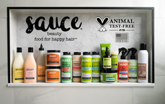 Sauce Beauty Creamy House Dressing Conditioner bottle on vanity ready for daily routine.