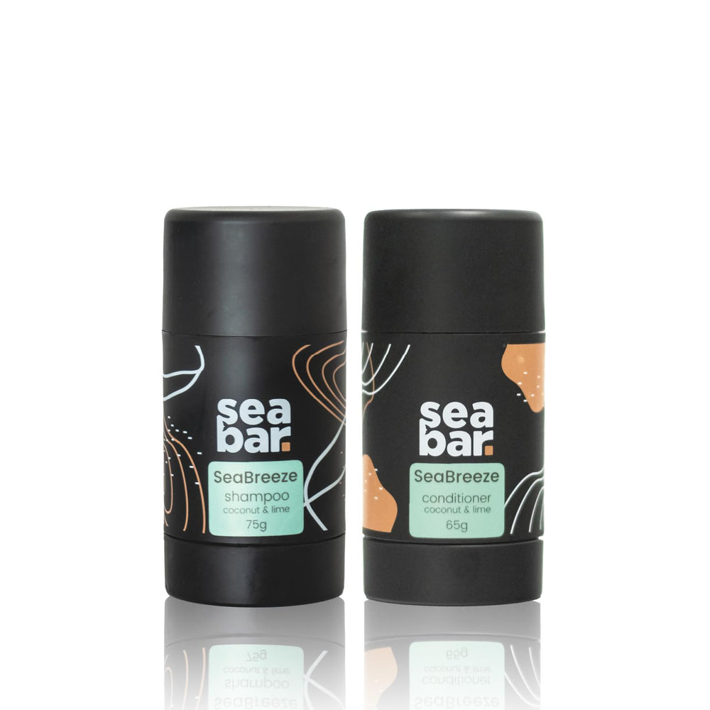 SeaBar shampoo bar in hand ready for application, compact travel-friendly solution for refreshing hair