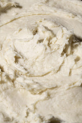 Vegan and cruelty-free Shea Radiance P.U.R.E. butter on a palm.