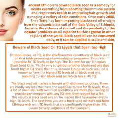 Amber bottle of Shea Terra Black Seed Oil in natural light, may aid skin hydration