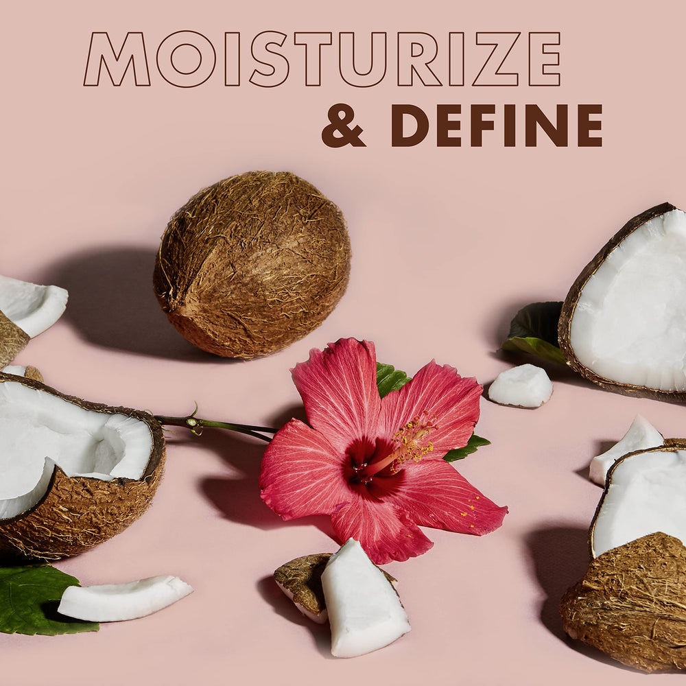 Twist-out styling application using SheaMoisture curl smoothie for even distribution.