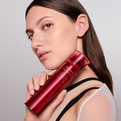 Shiseido Eudermine Activating Essence bottle with soft glow suggesting hydration